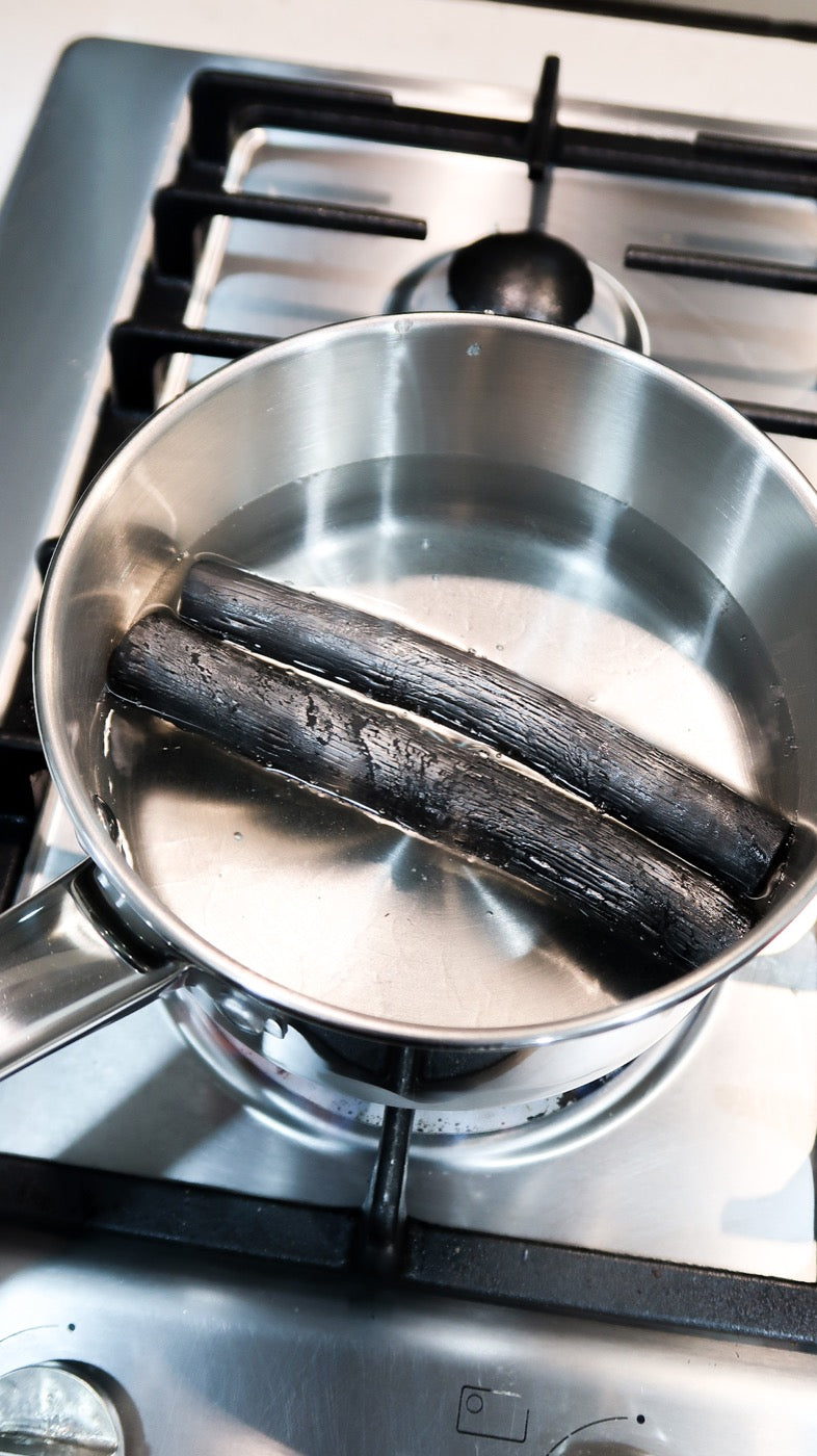 Simmer the SoL charcoal sticks in a pot of water to activate them