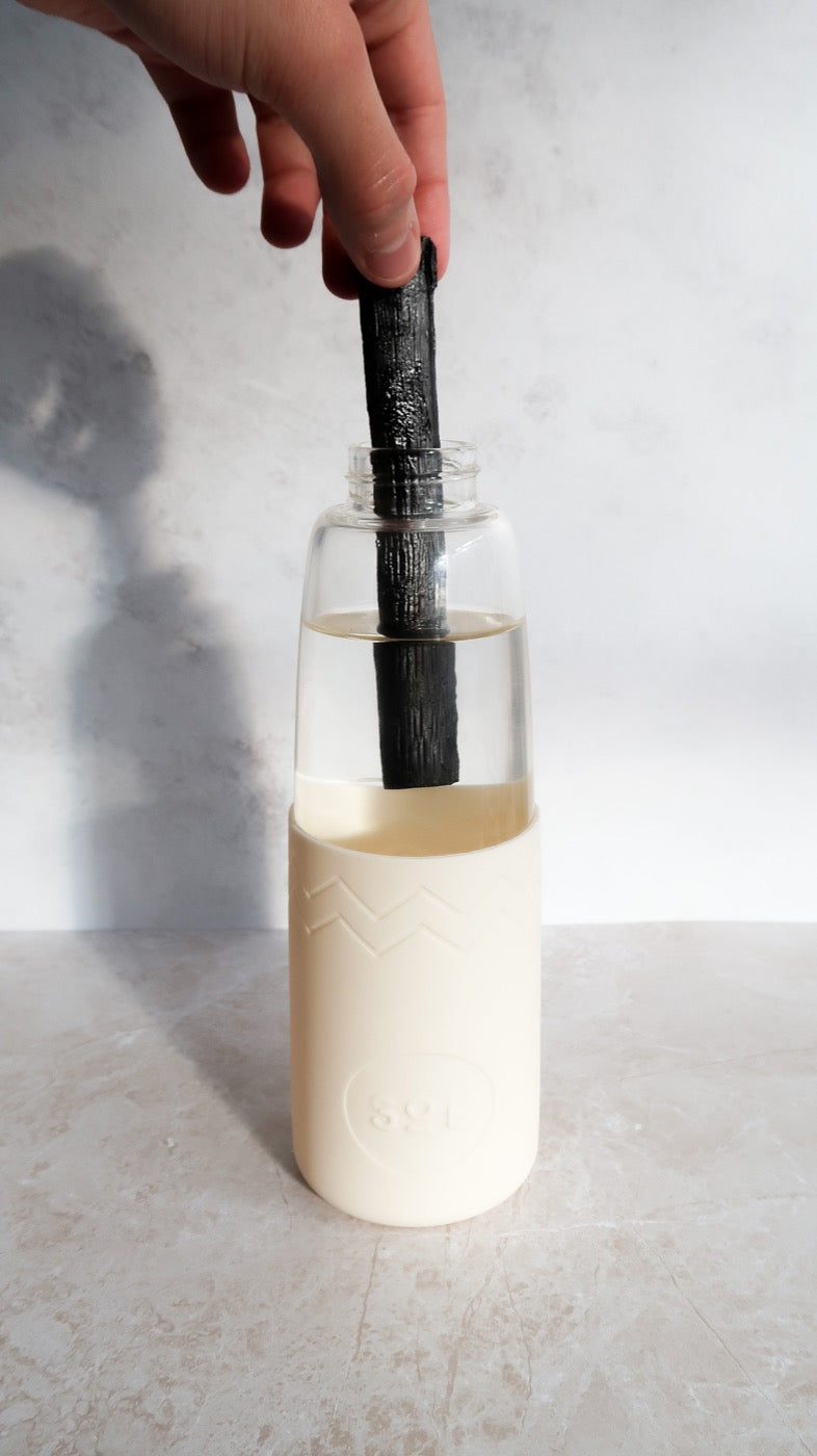 Drop a charcoal stick into your SoL bottle of water
