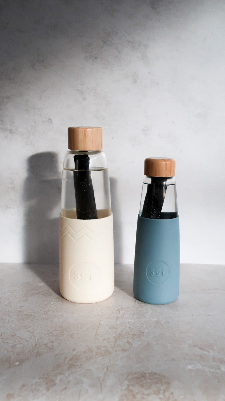 Filtered water in SoL bottles with the charcoal sticks inside
